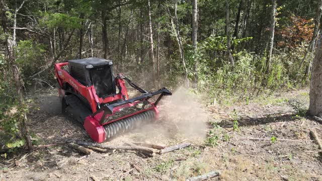Drum mulcher grinding brush in a cloud of dust, Lascassas, TN