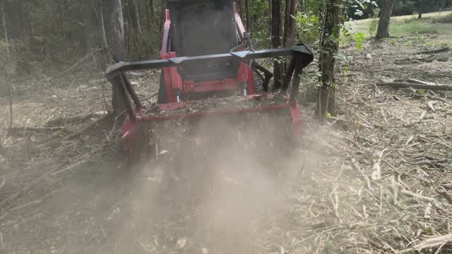 Mulch flying off the front of the drum mulcher, Rutherford County, TN